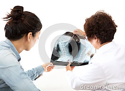 The doctor discusses with the patient with the patientâ€™s neck X-ray Stock Photo